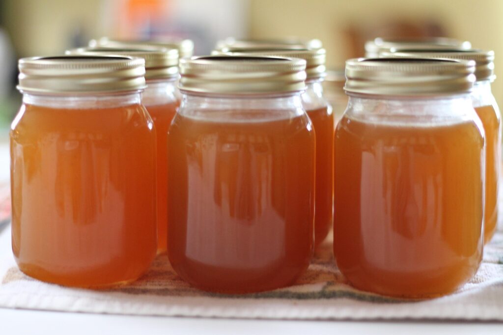 A group of jellies in mason jars